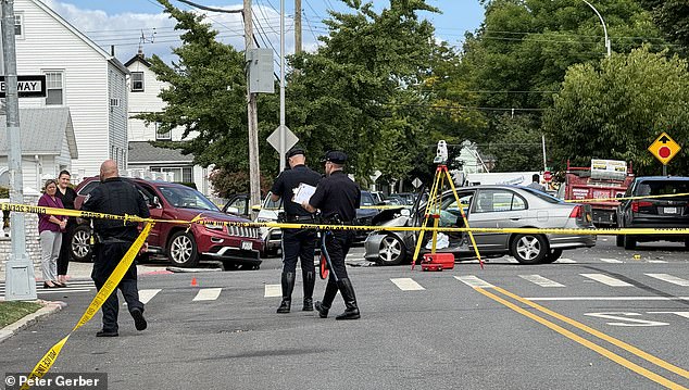 Police comb the scene of the crash where Noel died