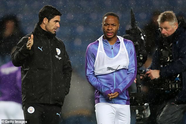 Arteta and Sterling pictured in December 2019 when they were both employed by Man City