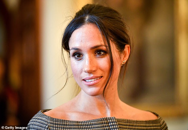 Pictured: Meghan Markle chats to people in the Drawing Room during a visit to Cardiff Castle in January