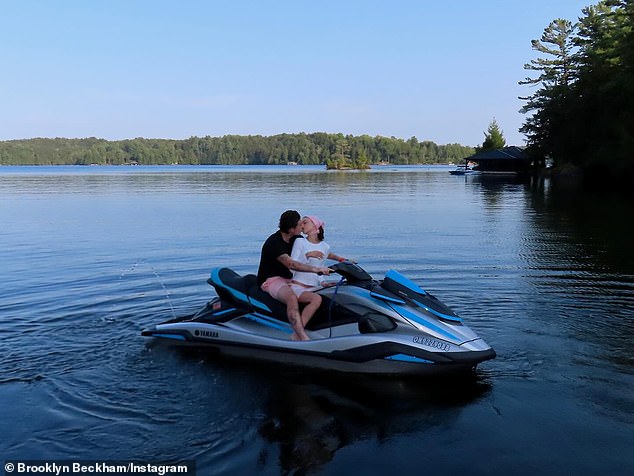 While another sees the loving couple kissing again, this time sitting on a jet ski