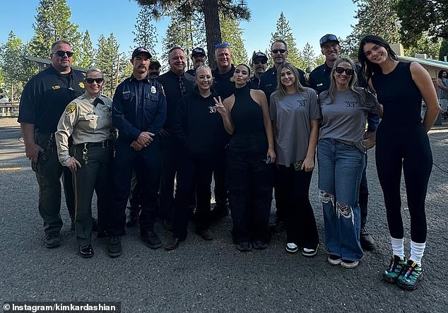 As part of her carousel, Kardashian added a photo of herself standing in the middle of a group of professionals training the youngsters in the program. Jenner was seen on the far right, towering over the others with her supermodel height