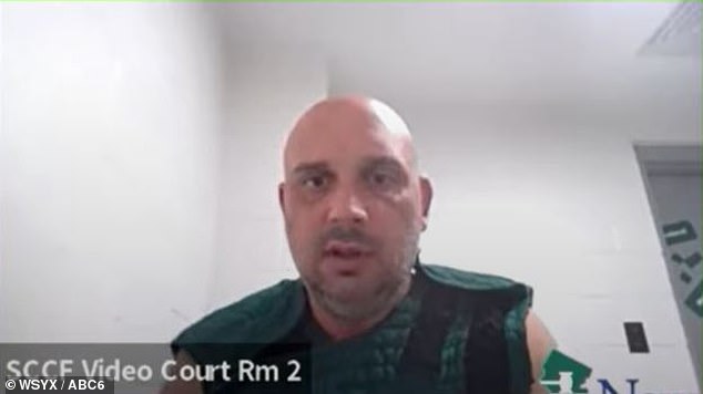 In his first hearing on Friday, he appeared before Judge Michael J. Silvanio via video link, where he was seen dressed in a green prison vest with Velcro shoulders