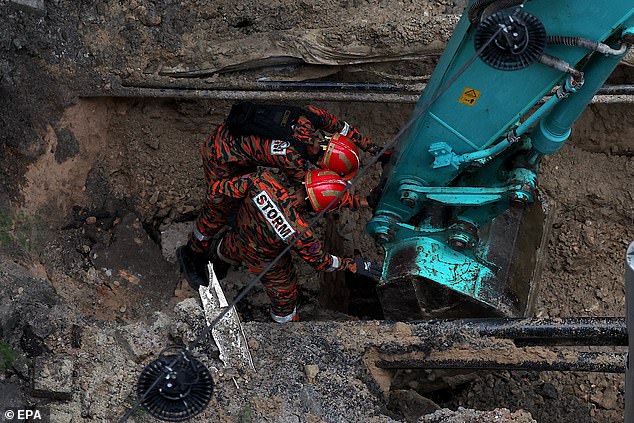 Excavators were later photographed at the crime scene, while rescue workers used sniffer dogs and robotic cameras to explore the underground network