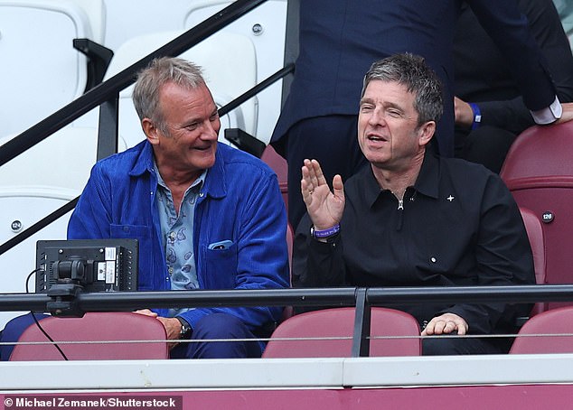 The 57-year-old rock singer appeared to be in high spirits as he watched Manchester City take on West Ham in the Premier League from the stands