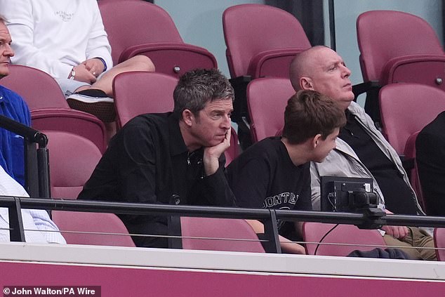 Noel looked relaxed in a black zip-up jacket as he watched his club take on West Ham head-to-head for top spot in the league