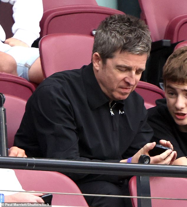 He was also joined by his son Donovan, 16, who was spotted in the stands watching the game intently with his father