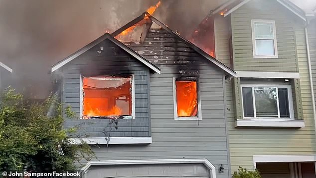 Video footage shows plumes of smoke rising over the area as flames burst from homes