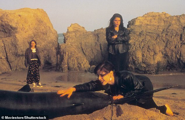 Tunney, Fairuza Balk and Neve Campbell are seen reenacting a scene on the beach in Malibu