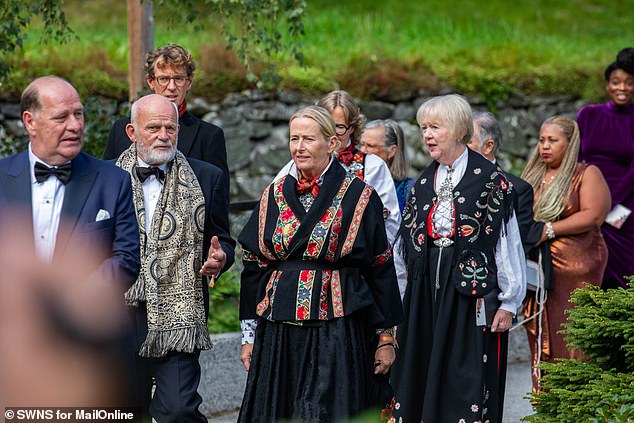 Guests in traditional dress attend the wedding of Princess Martha and Durek