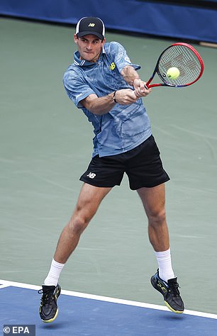 Paul plays a backhand return against Diallo in the third round