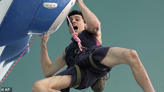 Hamish McArthur of Great Britain competes in the men's bouldering event and leads the semifinals during the sport climbing competition at the 2024 Summer Olympics, Wednesday, Aug. 7, 2024, in Le Bourget, France. (AP Photo/Tsvangirayi Mukwazhi)