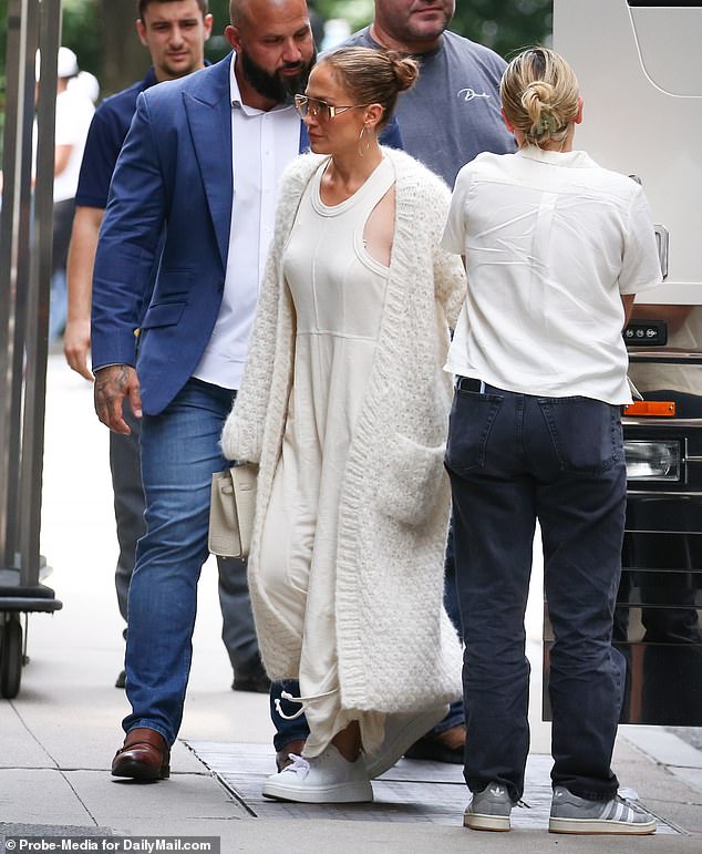 Just days later, Jennifer opted for a comfortable, oversized cream dress and matching cardigan as she arrived for dinner at a New York hotel