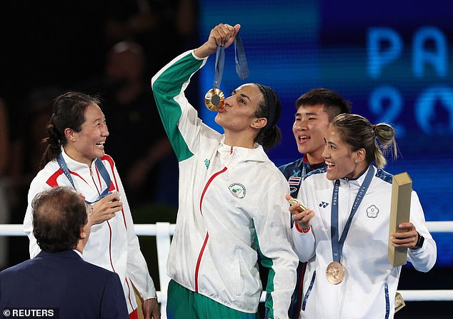 Algeria's Imane Khelif kisses her medal as silver medalist Liu Yang of China smiles