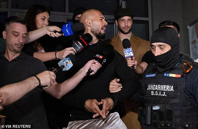 Andrew Tate and his brother Tristan are escorted outside the Directorate for Investigations of Organized Crime and Terrorism (DIICOT) in Bucharest, Romania