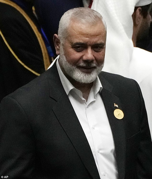 Hamas leader Ismail Haniyeh arrives at the Iranian parliament to attend the swearing-in ceremony of newly elected President Masoud Pezeshkian, in Tehran, Iran, Tuesday, July 30, 2024, hours before his death