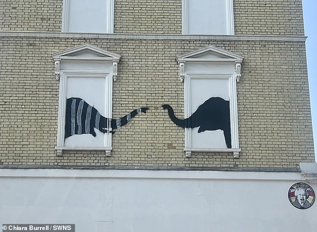 Banksy's elephant mural defaced with grey stripes just days after it appeared in Chelsea, London