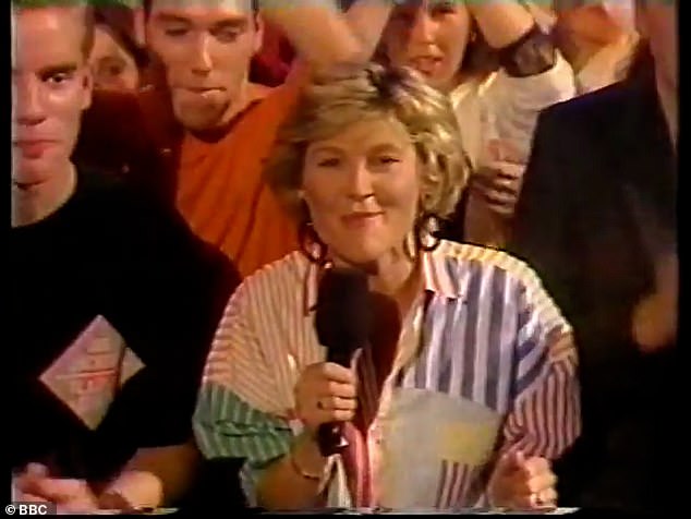 In the throwback clip, the TV star, who is now 64, appeared from the BBC studio floor in a striking, multi-coloured striped shirt