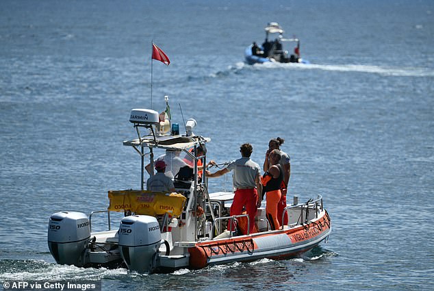 Rescue workers and divers from the Vigili del Fuoco, the Italian fire brigade, attended operations yesterday off the coast of Porticello, near Palermo.