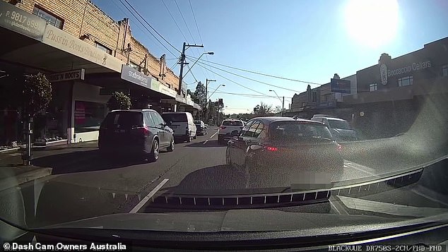 The woman stopped her car (pictured) on the narrow street after the minor accident, which occurred on Burke Road, in Kew, Melbourne's east, at around 10.30am on Tuesday