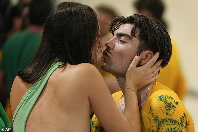 Australian cycling hero Conor Leahy shared a kiss with his glamorous girlfriend in Paris