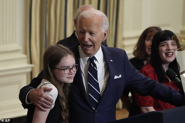 President Joe Biden sings Happy Birthday to Miriam Butorin after delivering a speech on a prisoner swap with Russia from the State Dining Room of the White House