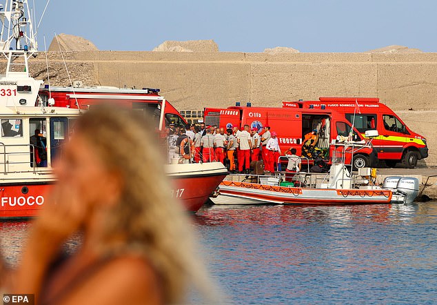 Experienced deep-sea cave divers arrive at the pier as the rescue operation continues for missing people aboard a sailboat that sank in Palermo, Sicily, Italy, August 19.