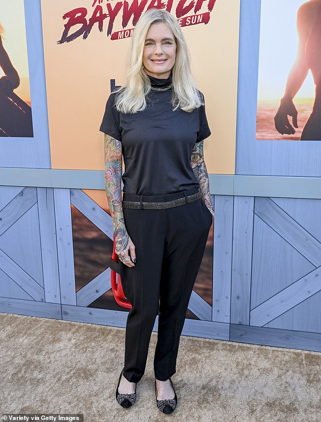 Erika Eleniak made a rare appearance this week. The former Baywatch beauty showed off fully tattooed arms as she wore a black short-sleeved top and long pants on Monday