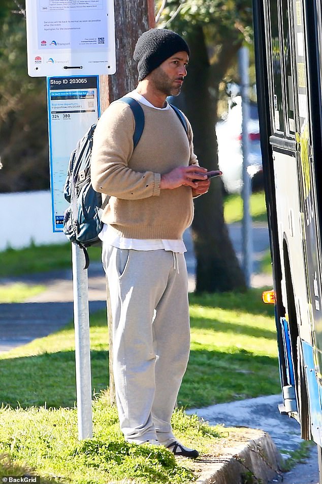 Alex Dimitriades (pictured) is best known for his starring role in Heartbreak High in the 90s. And the 50-year-old looked modest as he waited for the bus in Sydney