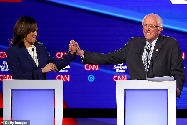 Senator Kamala Harris (D-CA) and Senator Bernie Sanders (I-VT) lend support to each other on the 2020 debate stage