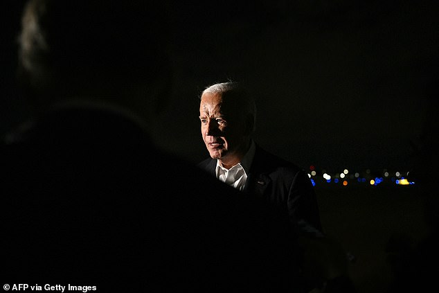 Biden speaks to the press before boarding Air Force One en route to California after his speech at the swan song conference