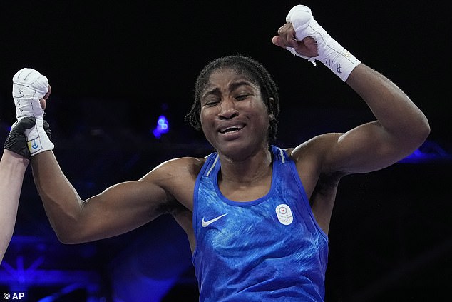 Cindy Ngamba crossed herself as she entered an Olympic arena where she was fighting a French opponent, Davina Michel. Boos rained down on Ngamba (pictured above)