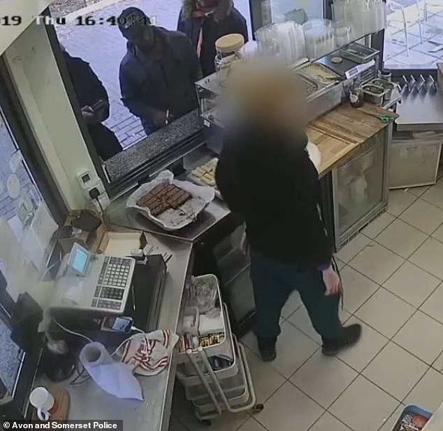 This is the moment three men managed to rob a small business in a card machine scam, netting them thousands. One of them can be seen manipulating the machine so that it refunds the card instead of charging it, while his accomplices distract a cafe worker