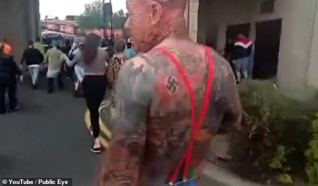 A man with a swastika tattoo is seen at a far-right protest in Sunderland this week