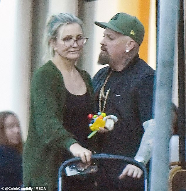 Cameron Diaz, 51, shared a loving kiss with her husband, Beni Madden, 45, during a casual dinner in Montecito on Monday