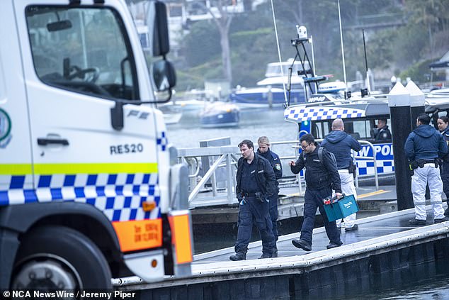 Sydney Water Police and fire and rescue workers at the scene where the bodies of a couple were found on a luxury yacht on Thursday, three days after they were last seen by their loved ones