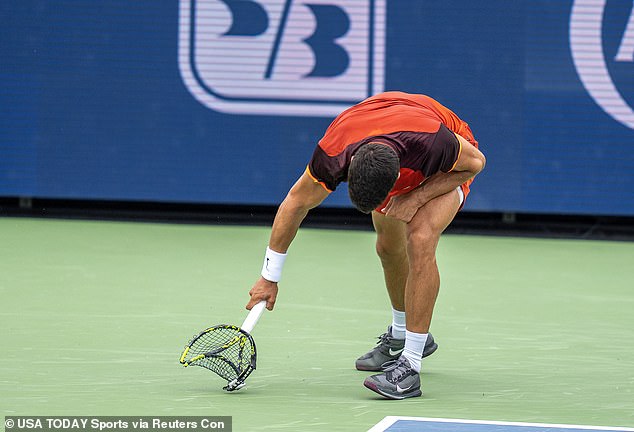 Carlos Alcaraz breaks his racket during his match against Frenchman Gael Monfils