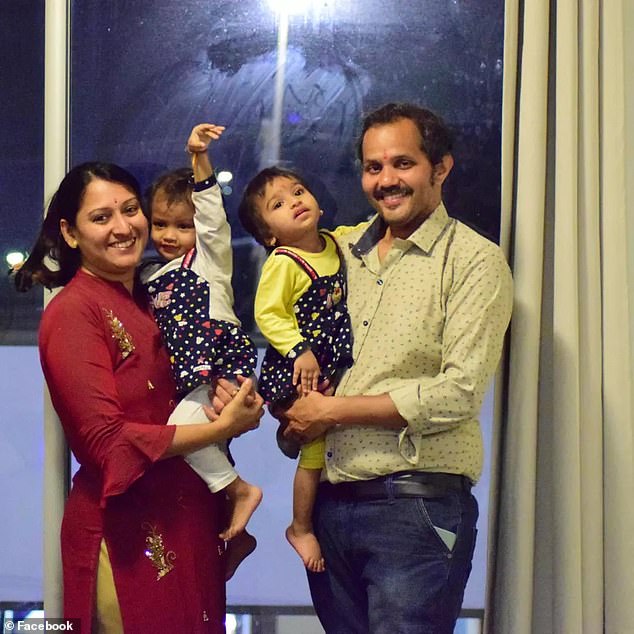 Anand Runwal (right) and his wife Poonam Runwal with their two-year-old twin daughters