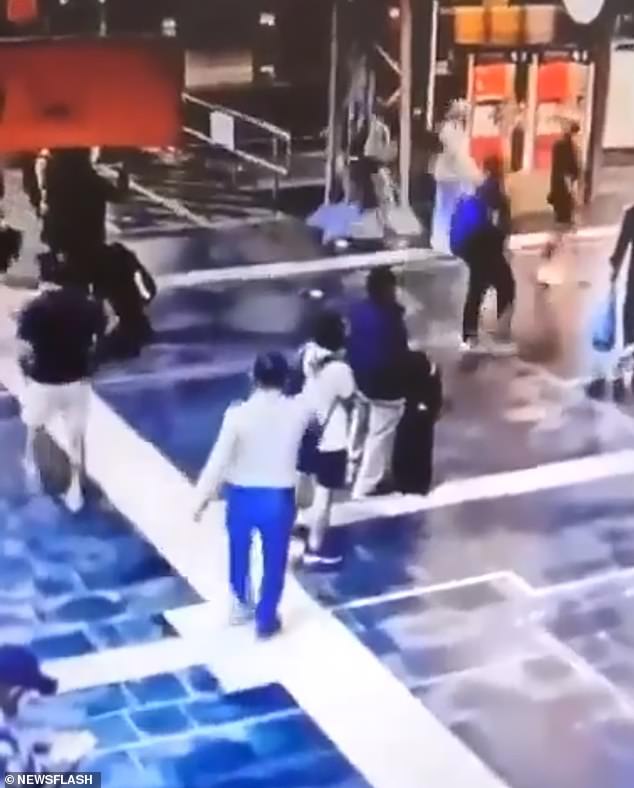 CCTV footage shows the suspect, 54, approaching the 27-year-old man from behind at the busy central station in Frankfurt, in the German state of Hesse, at around 9pm on August 20.