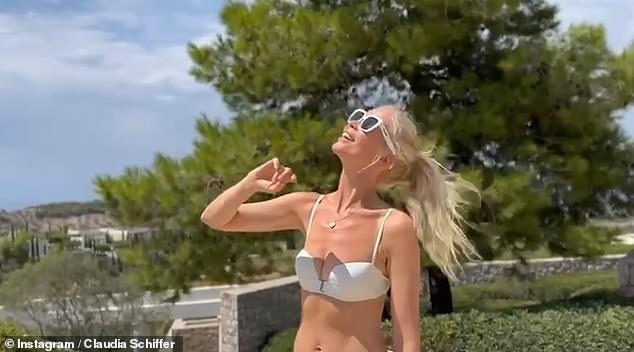 The model celebrated her 54th birthday by sharing a video online of herself posing in a two-piece suit while on vacation in Greece