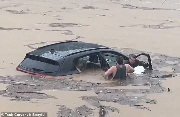 In Southbury, Connecticut, a man rescued an amputee motorist and his dog from a vehicle stuck in water