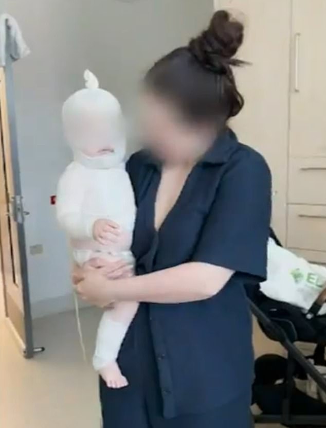 Luka (pictured with his mother on Thursday) was badly burned after a stranger spilled hot coffee on him in a Brisbane park