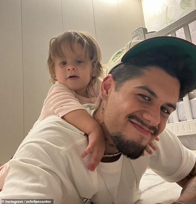 Zé Felipe said his one-year-old daughter, Maria Flor (pictured), was playing on a swimming ring when she slipped and fell into the pool