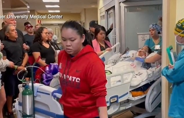 Zahriya is pictured being wheeled out of her hospital room after being taken off life support