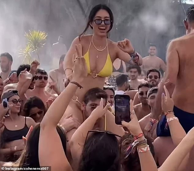 Footage shows Noa dancing in a yellow bikini at the party in Israel on Friday. The 26-year-old tells her friends and family: 'I'm happy to celebrate life itself with all of you'