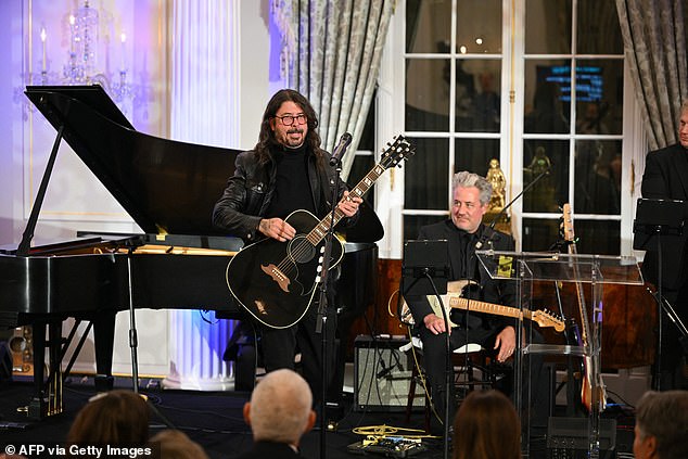 Dave Grohl performs during a celebration of the launch of the Music Diplomacy Initiative in the Benjamin Franklin Room of the State Department in Washington, DC, on September 27, 2023