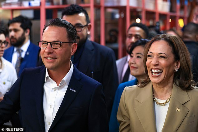 U.S. Vice President Kamala Harris and Pennsylvania Governor Josh Shapiro during a visit to the Reading Terminal Market in Philadelphia, Pennsylvania, U.S., July 13, 2024