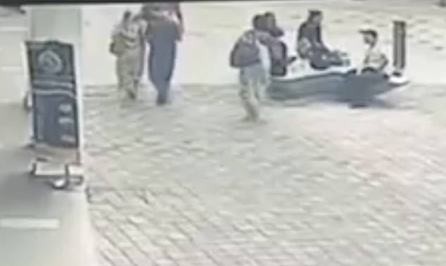 Footage shows Vijaya Lakshmi walking on the sidewalk as usual before the collapse occurred