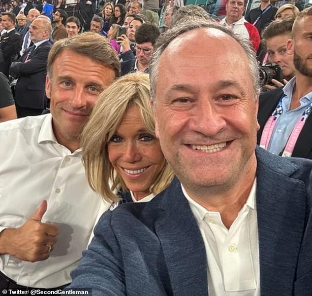 Doug Emhoff took a selfie with French President Emmanuel Macron and his wife Brigitte during the women's basketball final at the Olympic Games