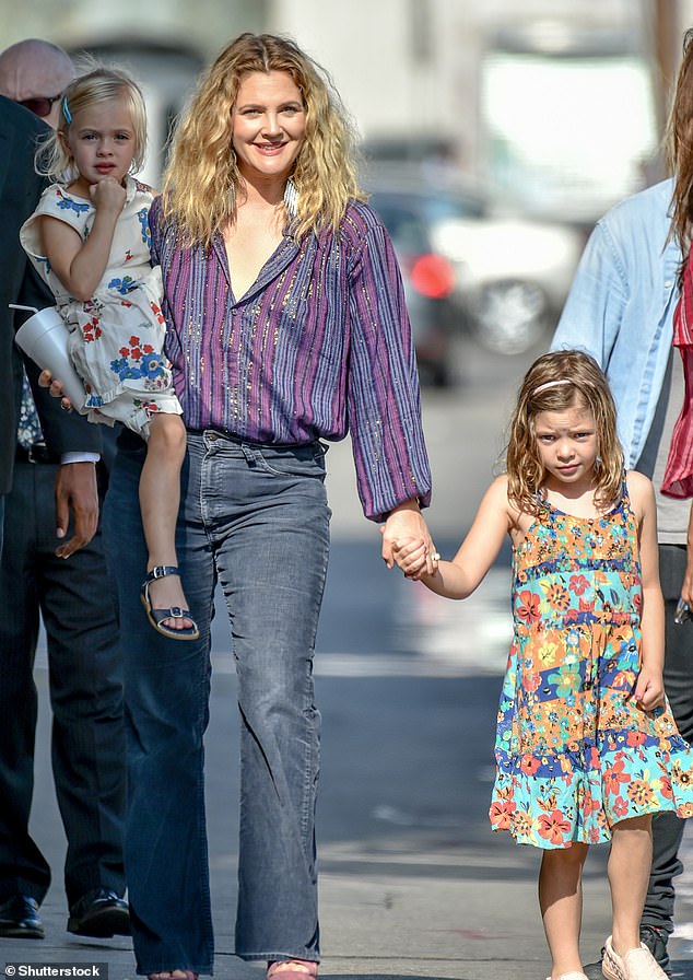 Drew Barrymore posted a warning for mothers who 'allow children' to access the internet. She is pictured with her children in 2018