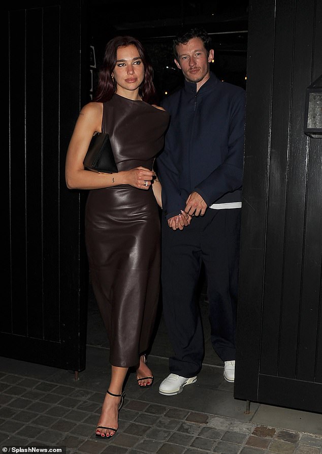 Dua Lipa, 28, set temperatures soaring in a chocolate brown leather midi dress on Friday as she enjoyed a date night with boyfriend Callum Turner, 34, at London's Chiltern Firehouse